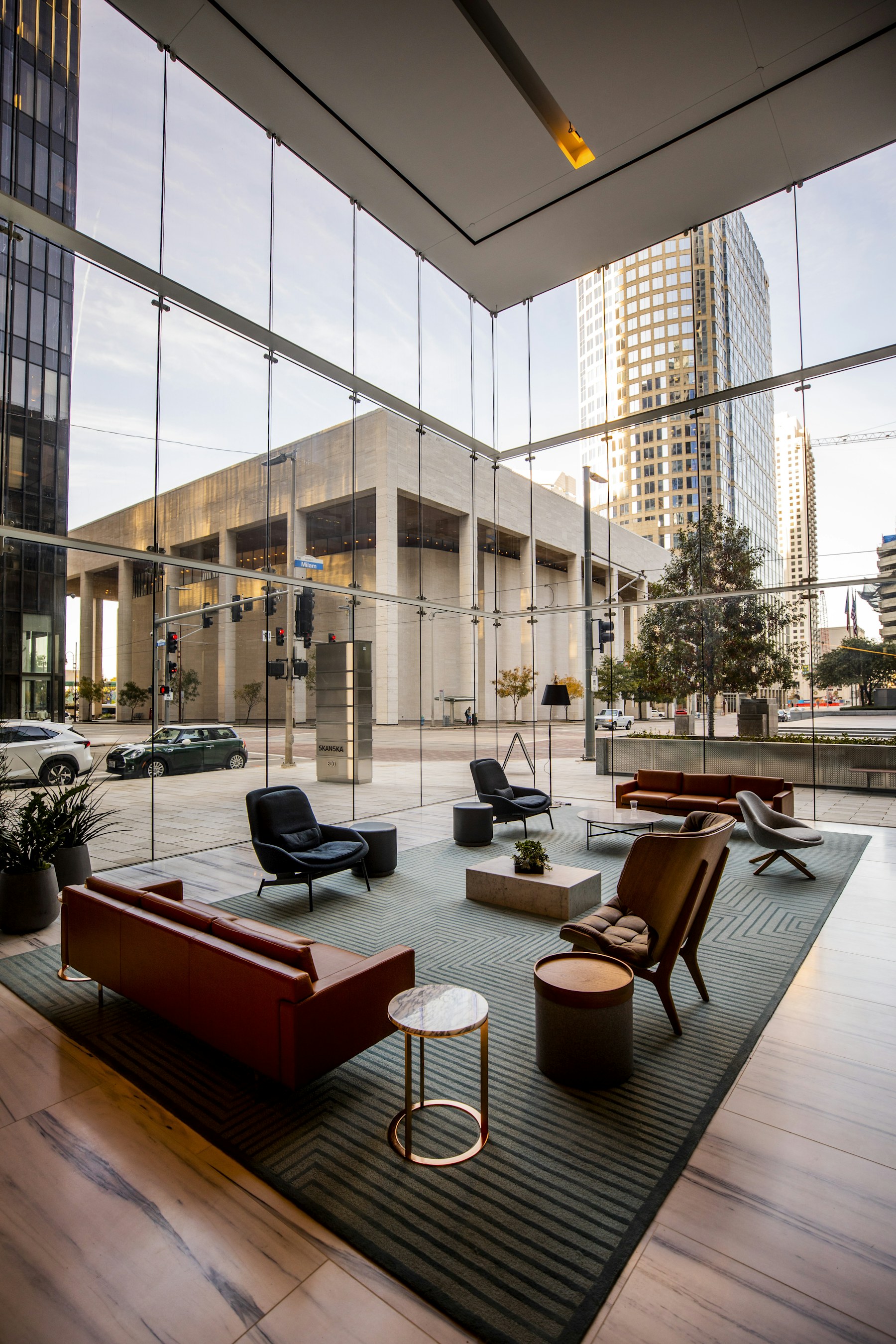 A bright, modern corporate lobby with large windows and seating